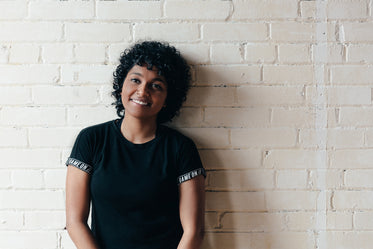 curly haired woman smiling