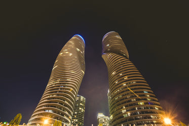 curvy condo towers at night
