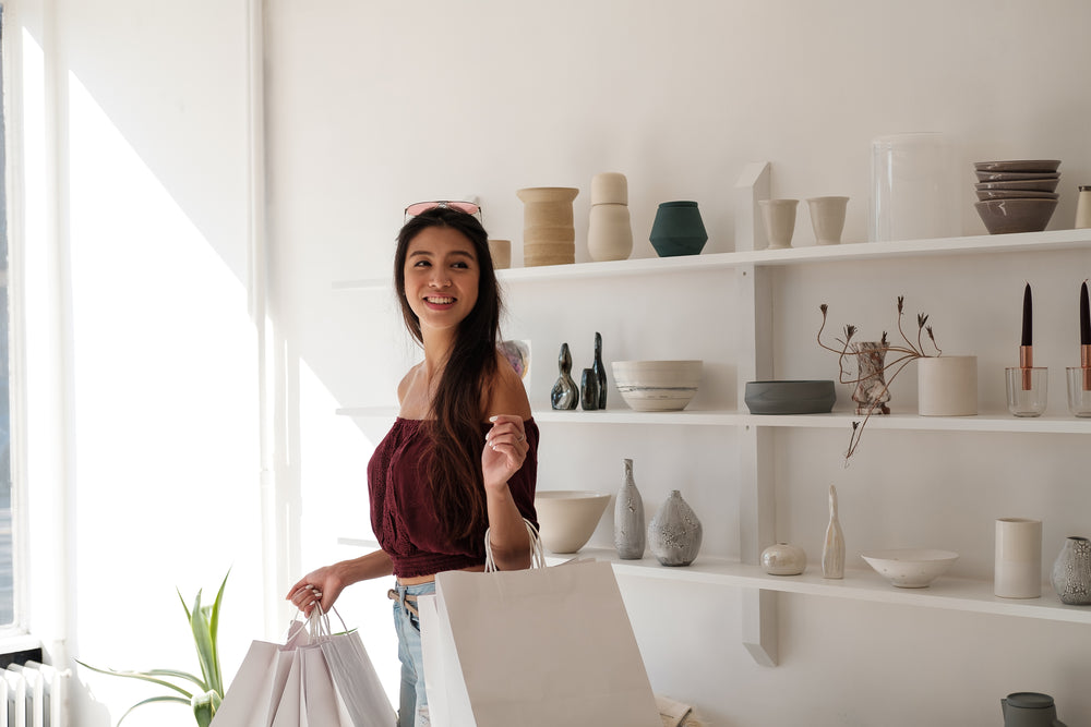 customer with shopping bags in hand