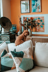 cute brown puppy sitting in orange living room