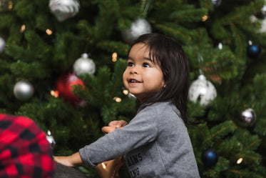 cute indian boy excited for christmas morning