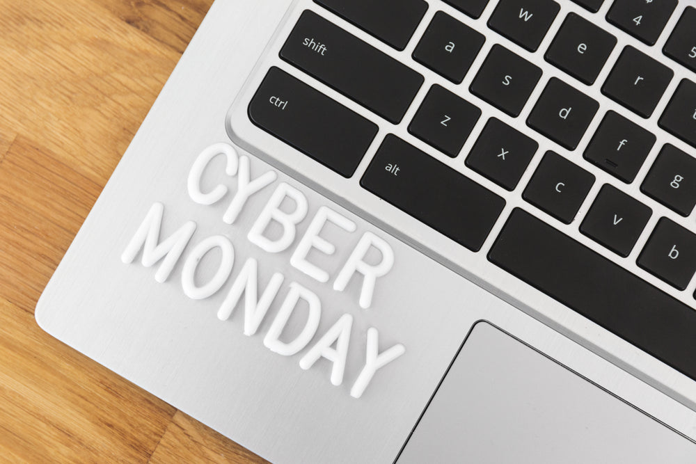 cyber monday lettering on laptop