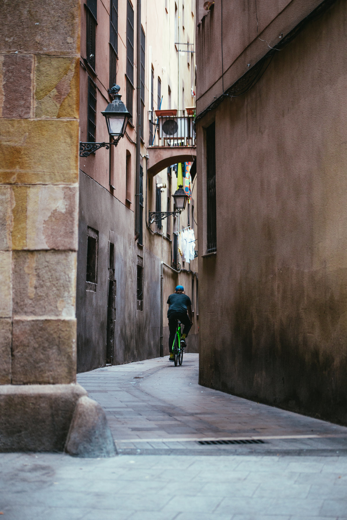 cycling down narrow alley