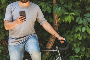 cyclist holding phone