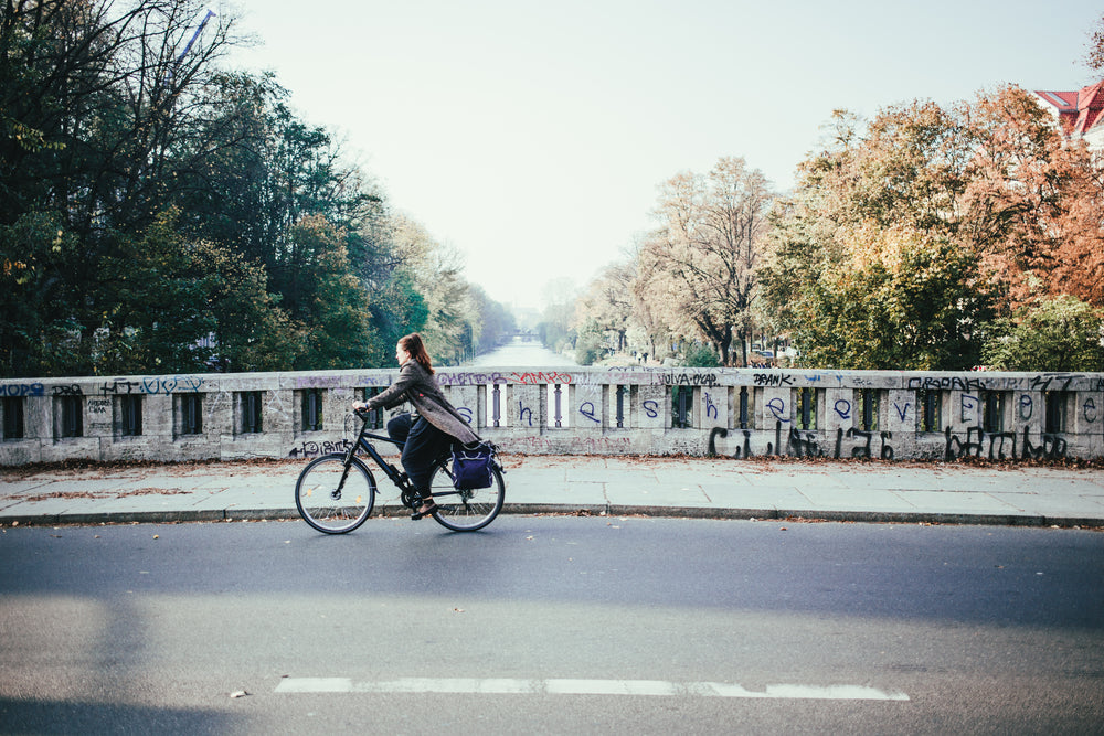 cyclist on river bridge