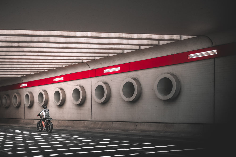 cyclist riding through stunning underpass