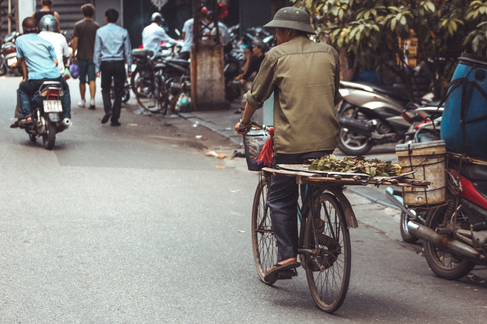 cyclist taking a leisurely ride through street