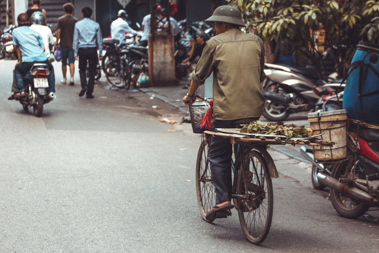 Cyclist Taking A Leisurely Ride Through Street