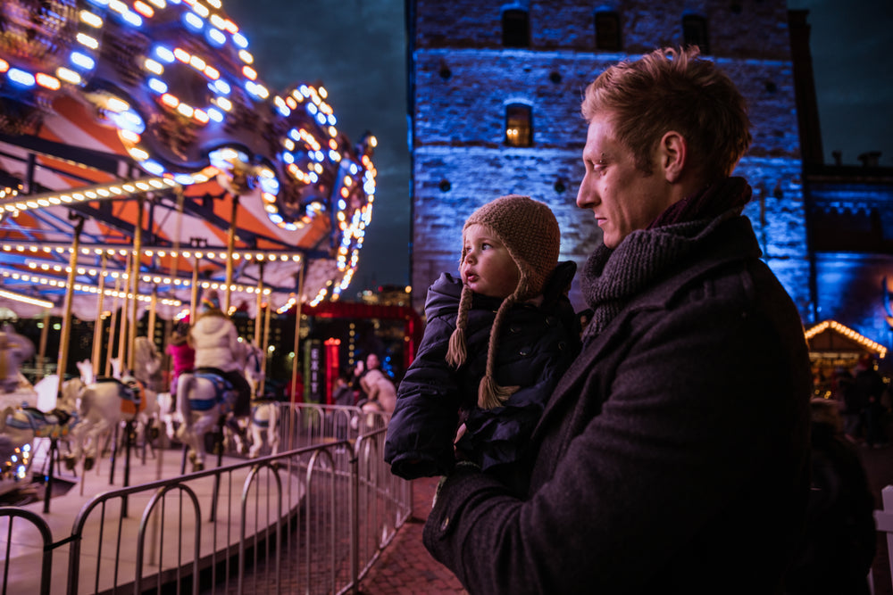 dad and daughter watching carousel