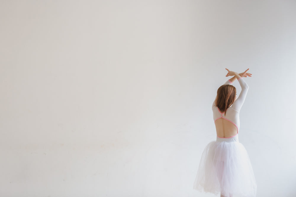 dancer in white on white