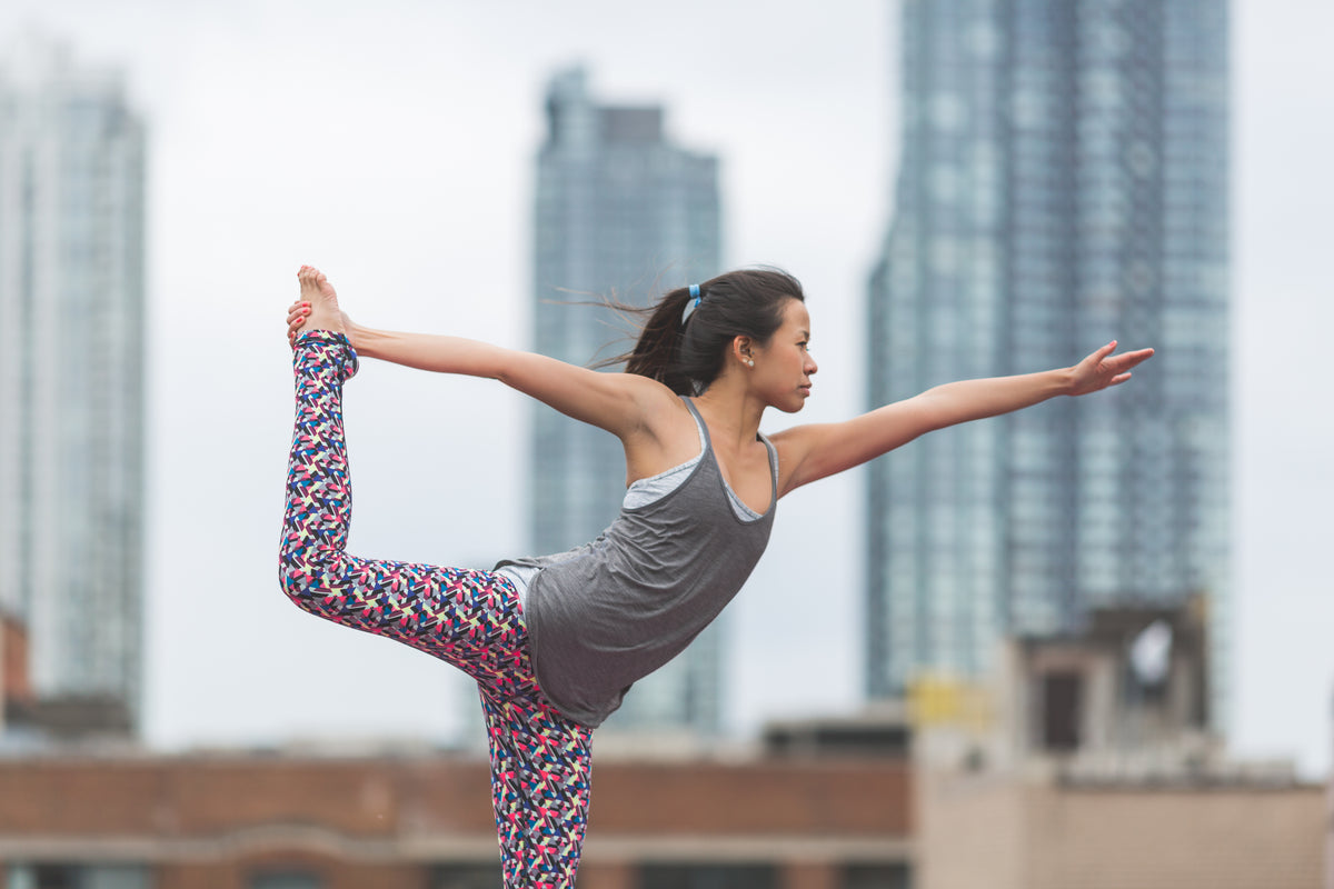 dancers pose yoga rooftop