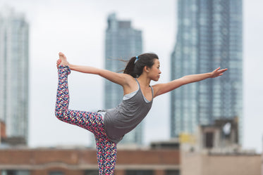 dancers pose yoga rooftop