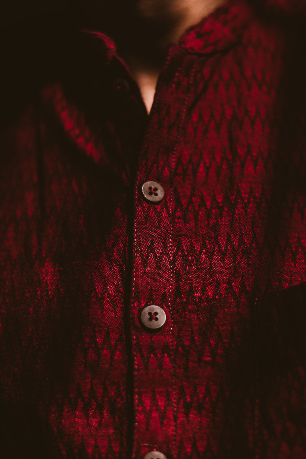 dark red shirt with wooden buttons