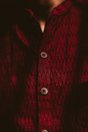 dark red shirt with wooden buttons