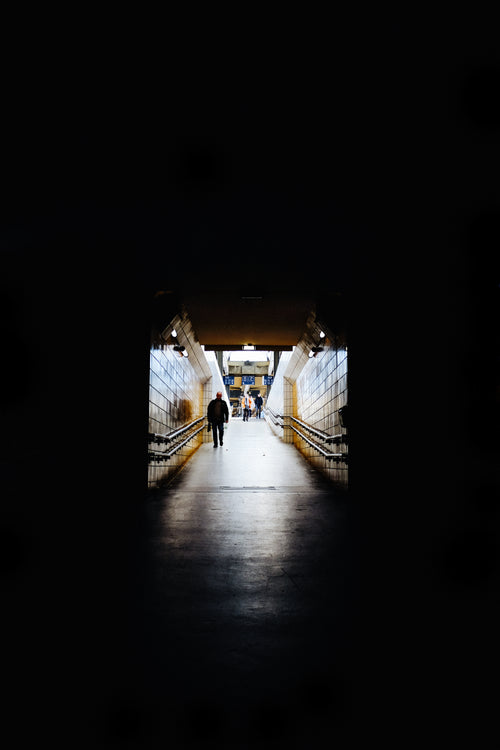 darkness engulfing subway exit