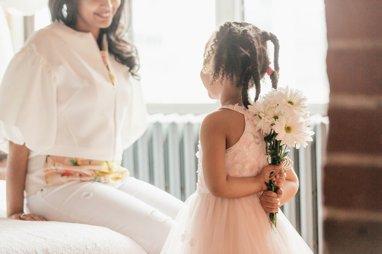 Daughter About To Suprise Mom With Flowers