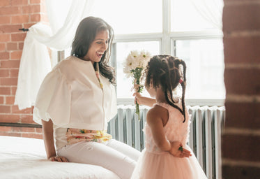 daughter suprises mom with flowers