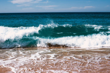 deep blue water rolling into the shore