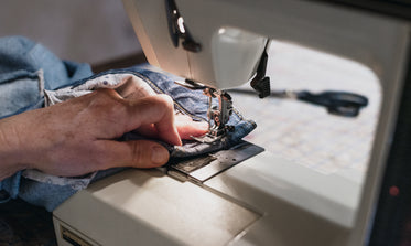 denim runs through sewing machine