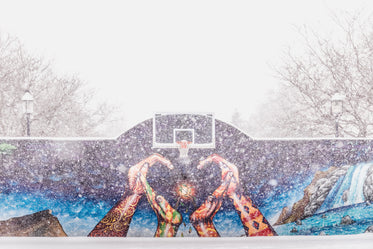 deserted outdoor baseball court on snow day