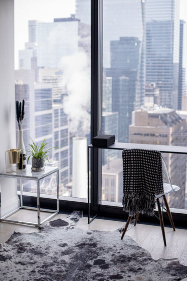 desk and chair look out to the city below