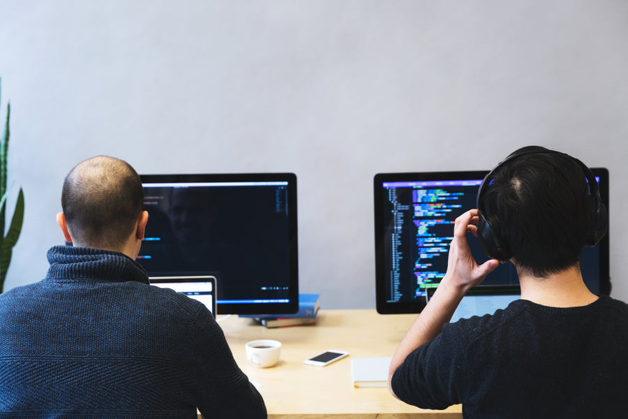 Developers coding side by side