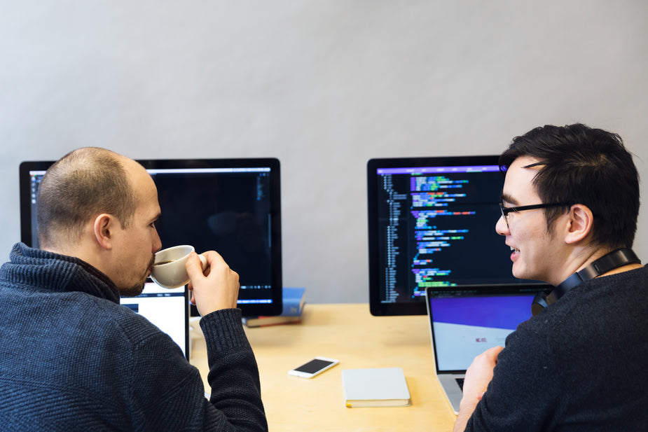 Picture of Developers Discussing Javascript Code — Free Stock Photo
