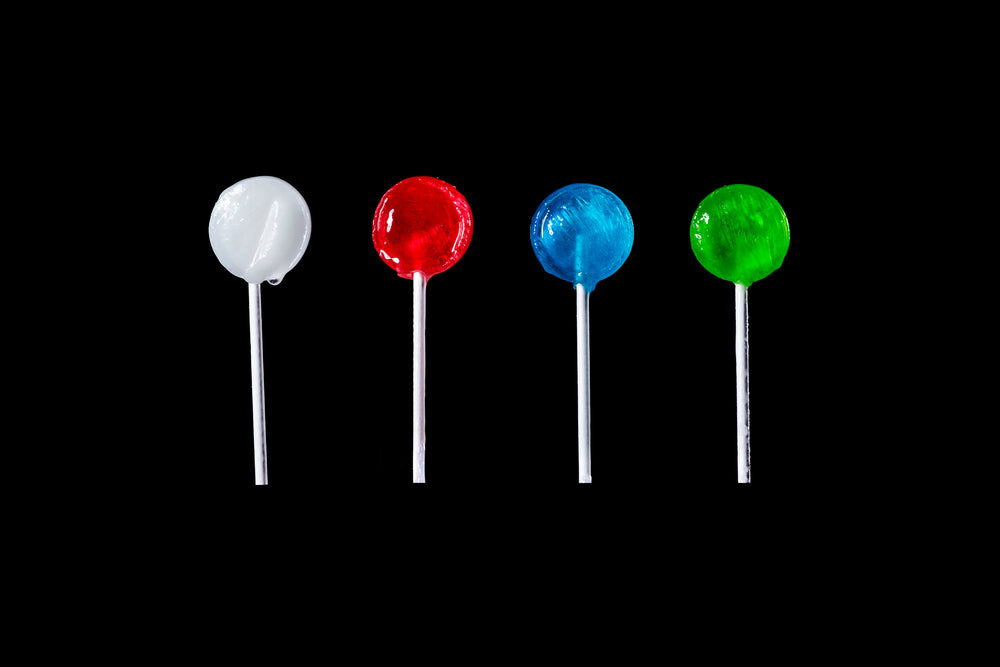 https://burst.shopifycdn.com/photos/different-colored-lollipops-on-black.jpg?width=1000&format=pjpg&exif=0&iptc=0