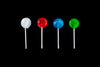 different colored lollipops on black