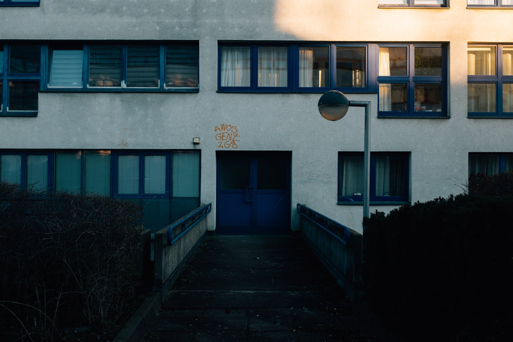 dimly lit building with blue door