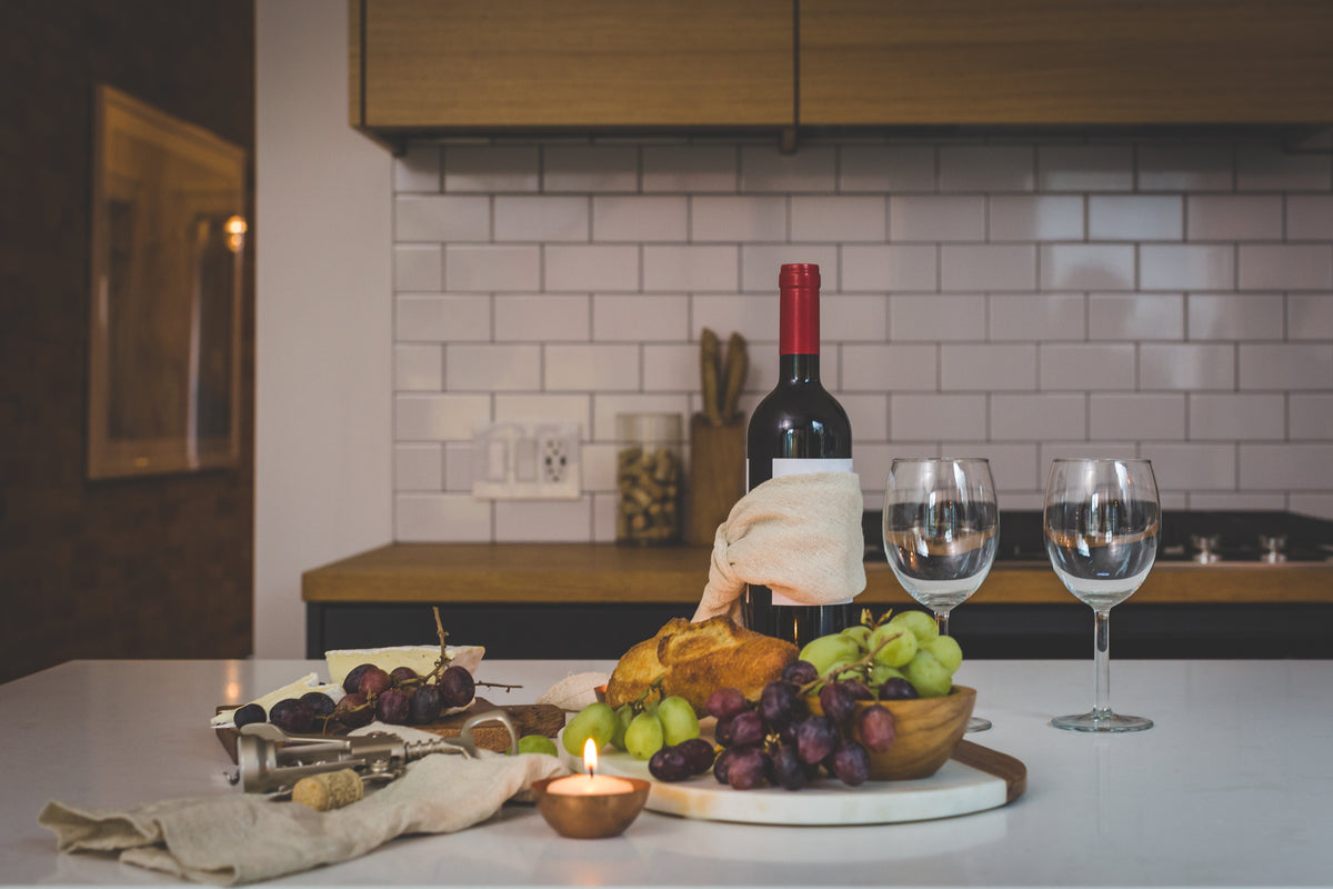 A dinner party table laid with matching glassware