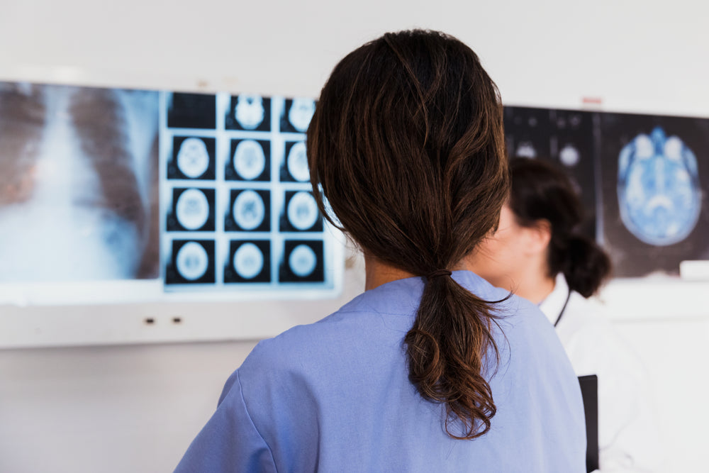 doctor and nurse examine x-rays