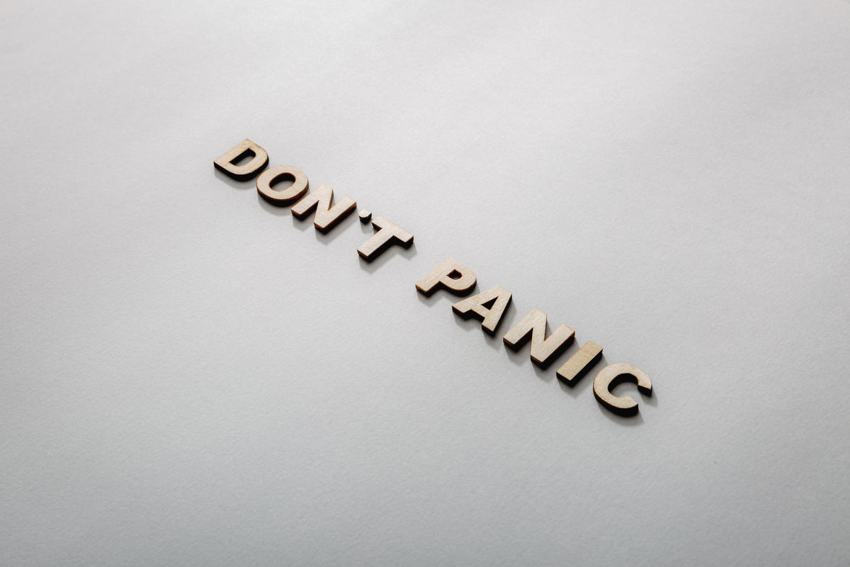 don't panic in wooden letters