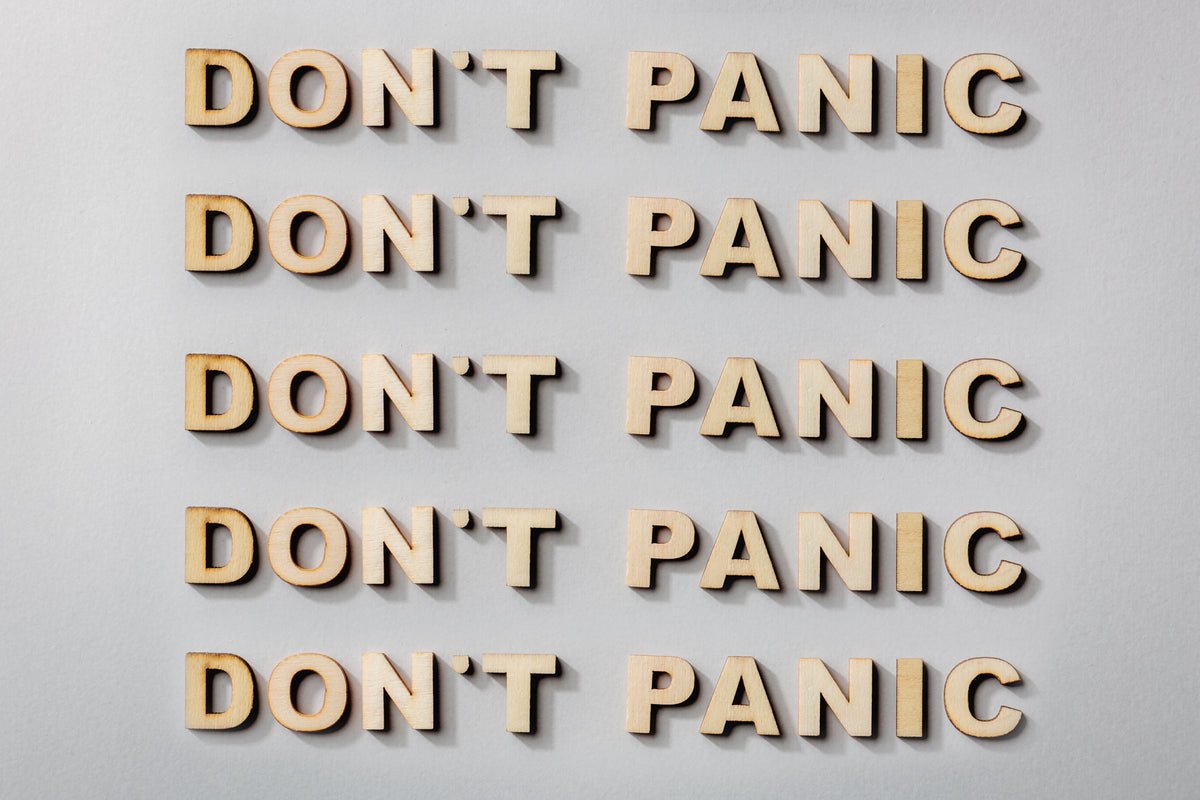 don't panic statement in wooden letters