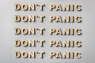 don't panic statement in wooden letters