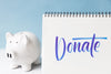 donate' written in cursive next to a piggy bank