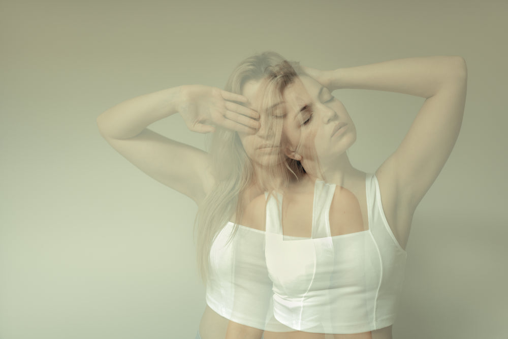 double exposure of a woman holding up her arms