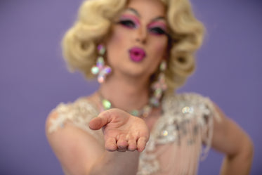 drag queen blowing a kiss only hand in focus