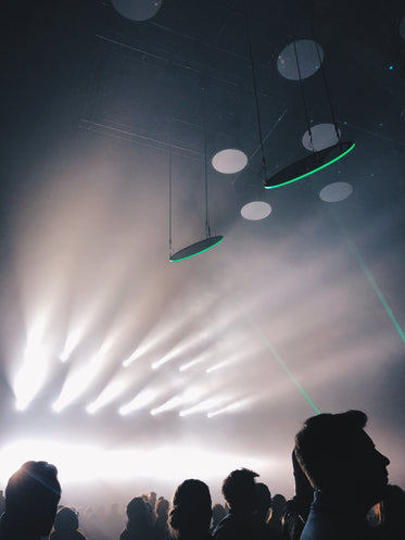 dramatic white lights at a concert