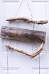 drift wood hanging on a white door