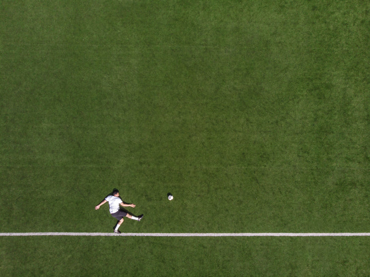 drone-birds-eye-photo-of-striker-kicking