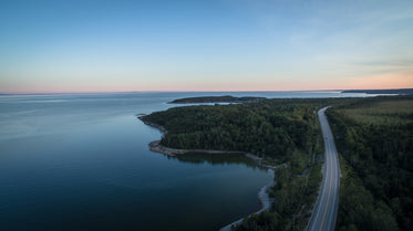 drone photography of lakeside highway