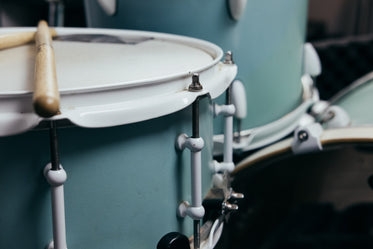 drumsticks resting on snare