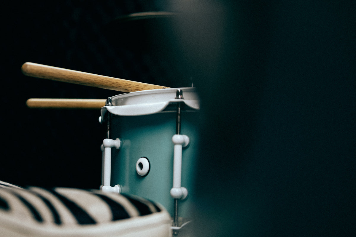 drumsticks sitting on snare