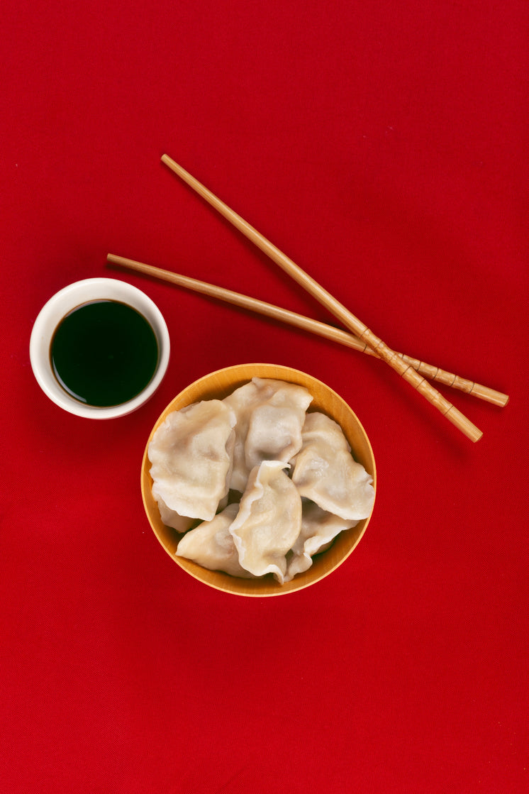 dumplings-chopsticks-and-sauce-on-a-red-cloth-viewed-from-above.jpg?width=746&format=pjpg&exif=0&iptc=0