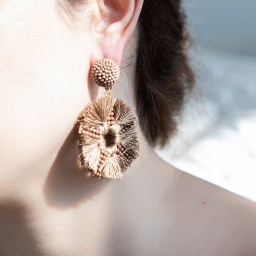 Ear Close Up With A Light Brown Statement Earring