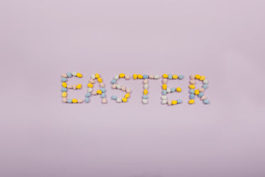 easter written in chocolate eggs on purple background