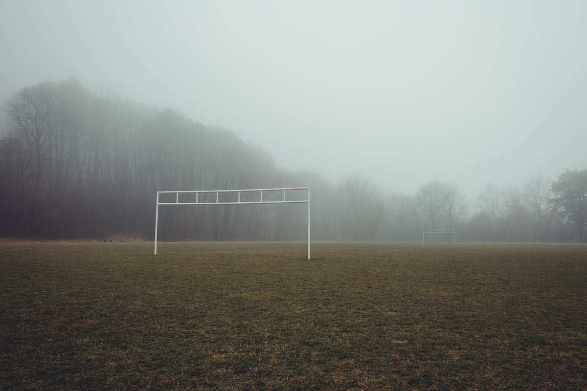 eerie view of a foggy soccer field