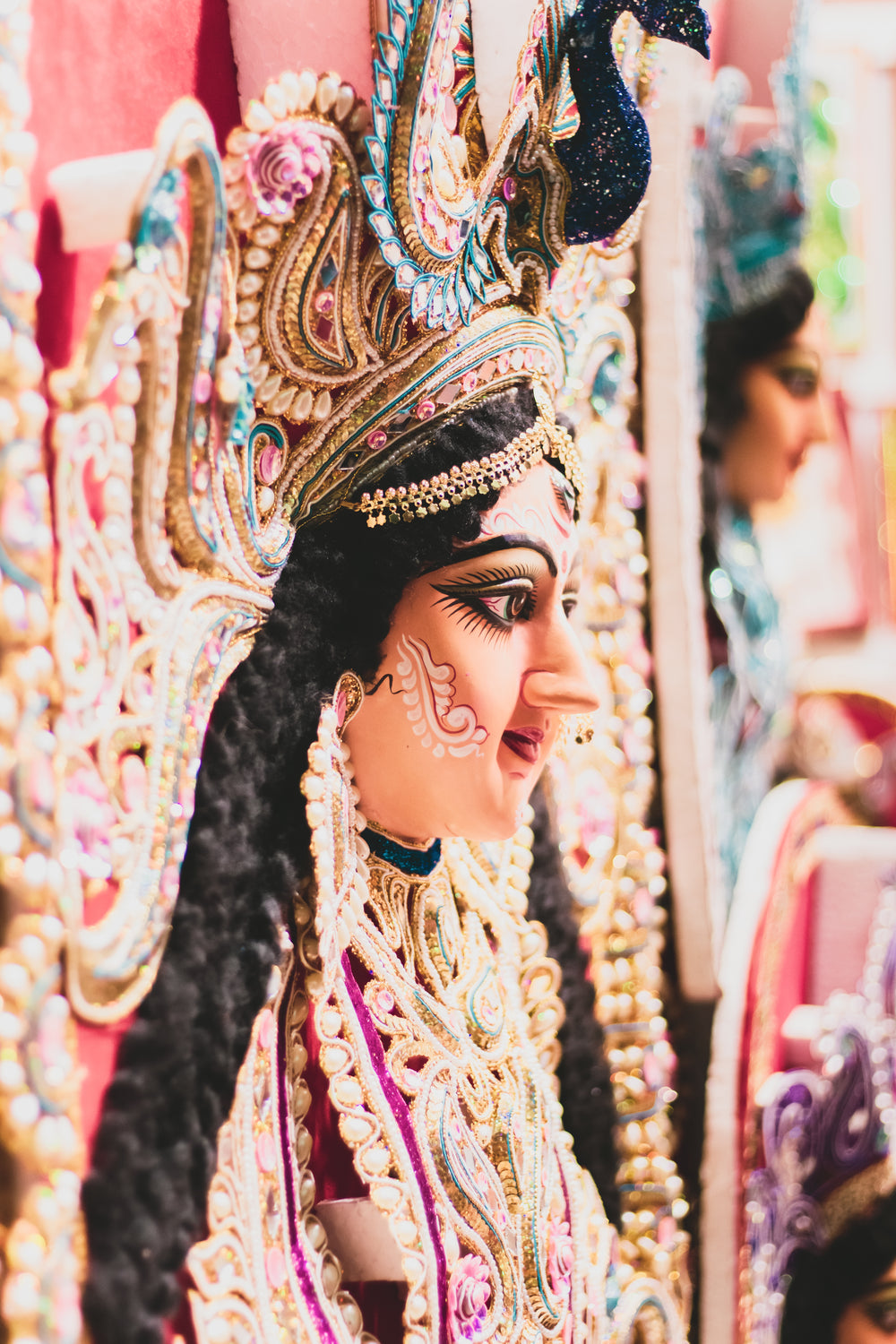 elaborately decorated female sculpture