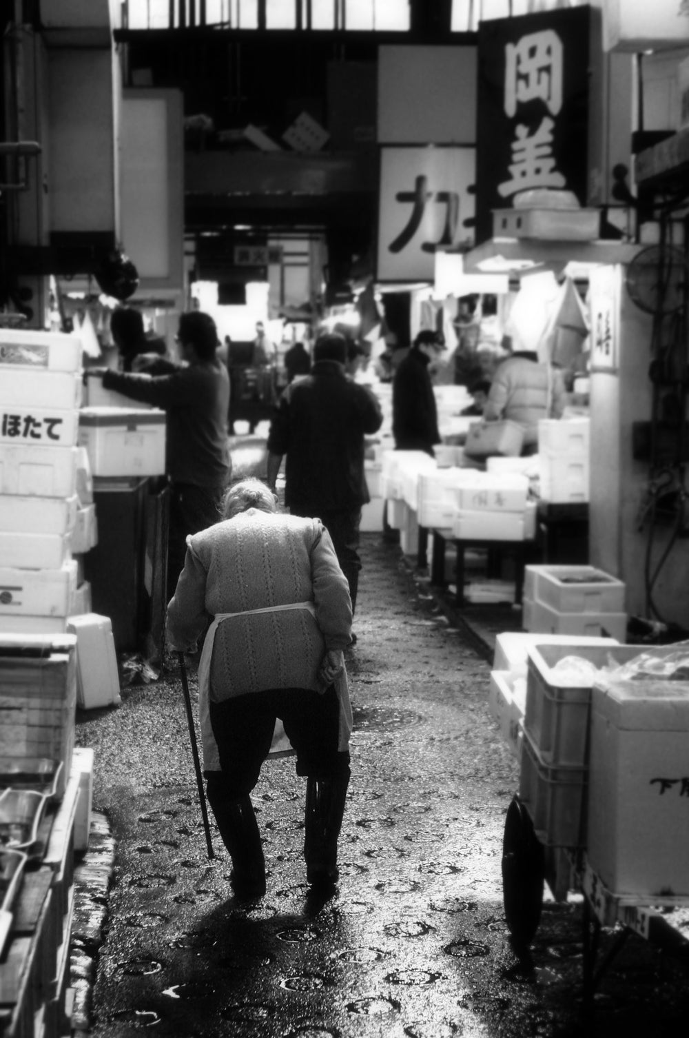 elder walking through market